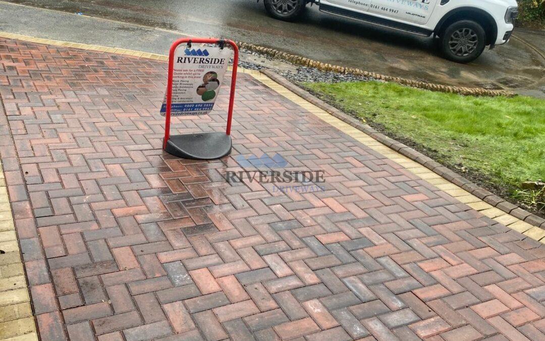 Red block paving installation at Royton, Oldham